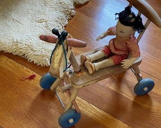 Rag doll on pull toy horse