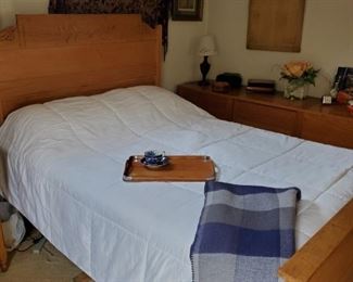 Antique full-size bed with spoon carved headboard