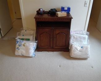 TV Cabinet and lots and lots of blankets