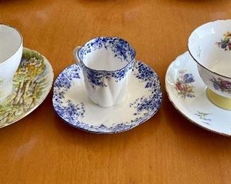 Item 388:  Shelley "Daffodil Time" Cup & Saucer (left):  $20    (SOLD)                                                                                                    
Item 389:  Shelley "Dainty Blue" Cup & Saucer (middle):  $24           (SOLD)                                                                                                  Item 390:  Shelley Cup & Saucer (right):  $28
