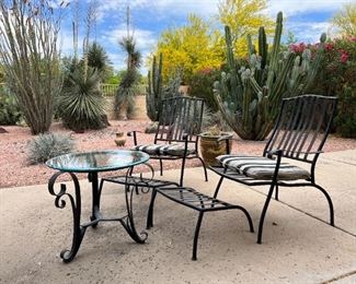 Outdoor wrought iron chairs with foot rests and wrought iron circular table	Table 22” x 24” in diameter chairs 36” x 25” seating height 19 inches	
