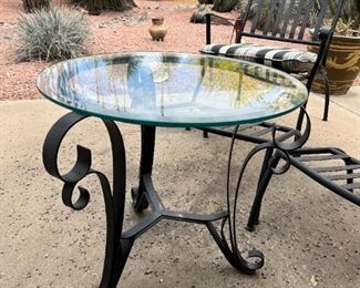Outdoor wrought iron chairs with foot rests and wrought iron circular table	Table 22” x 24” in diameter chairs 36” x 25” seating height 19 inches	
