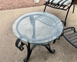 Outdoor wrought iron chairs with foot rests and wrought iron circular table	Table 22” x 24” in diameter chairs 36” x 25” seating height 19 inches	

