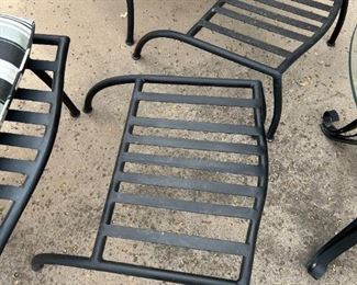 Outdoor wrought iron chairs with foot rests and wrought iron circular table	Table 22” x 24” in diameter chairs 36” x 25” seating height 19 inches	
