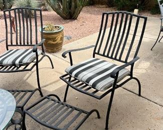 Outdoor wrought iron chairs with foot rests and wrought iron circular table	Table 22” x 24” in diameter chairs 36” x 25” seating height 19 inches	
