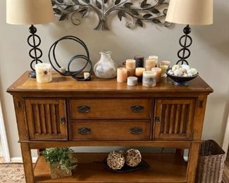 Mission style hutch with decor and area rug