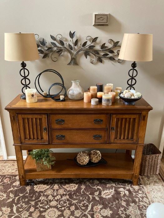 Mission style hutch with decor and area rug