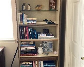 Book shelf filled with books and decor