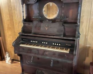 Antique pump organ, needs extensive work - wonderful cabinet. 