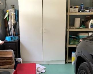 White two door garage storage cabinet