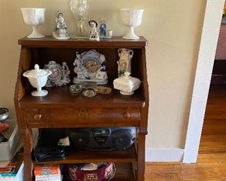 Japanese figurines, milk glass, small secretary, cassette/cd player, cassettes and the entire bible in cds..