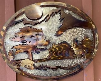 Carved metal wall art.