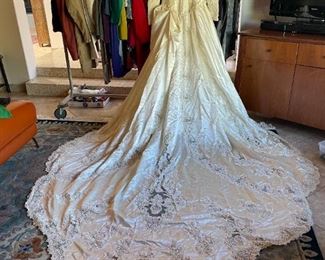 Satin bridal gown with Alencon lace and an 8 foot train. Ladies clothing.