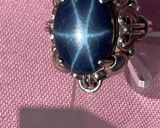 Five carat star sapphire ring in 14k white gold setting.