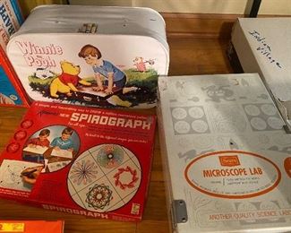 Winnie the Pooh case with Legos, Spirograph, sears microscope lab