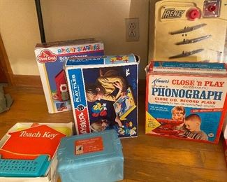 Teach key, geometric blocks, phonograph, Play-Doh bright starters, Frenzy pinball game,