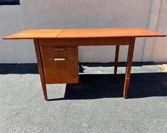 Danish teak desk with sliding/ drop leaf top. #3244