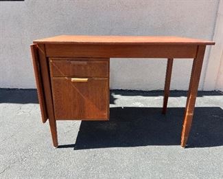 Danish teak desk with sliding/ drop leaf top. #3244