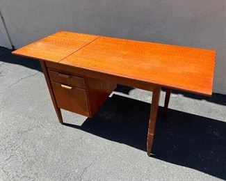Danish teak desk with sliding/ drop leaf top. #3244