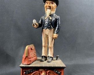 Retro Reproduction Uncle Sam Cast Iron Coin Bank, Works. Very neat piece, operates smoothly. Insert a coin into Sam's hand and press the button. His hand will swing down, drop the coin as the bag opens automatically and his beard wiggles. Tested with pennies and nickels.