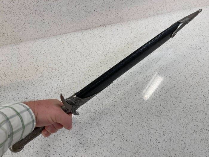 Measures around 67 cm in length. High-quality Sheath included. Made from actual Stainless Steel, with a mirror-like finish! They are highly detailed, high-end collection pieces. Its a superb replica sword -  used in great shape.
