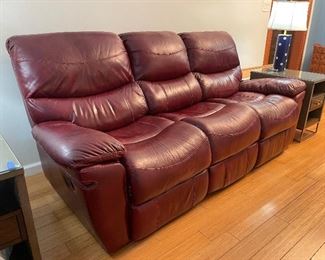 25_____ $395 
Leather sofa deep red / burgundy 2 manual recliners  • 40Tx 88Wx  22D 