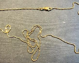 5_____ $100 
14kt garnet pendant & chain (0.08oz)