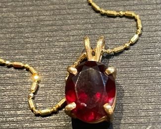 5_____ $100 
14kt garnet pendant & chain (0.08oz)