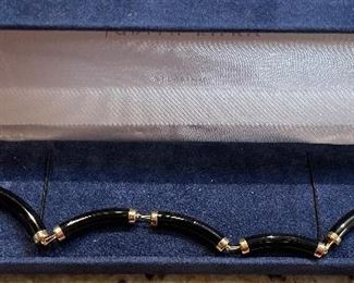 13_____ $140 
14kt yellow gold and Onyx bracelet chinese design 8inches
