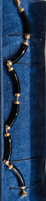 13_____ $140 
14kt yellow gold and Onyx bracelet chinese design 8inches
