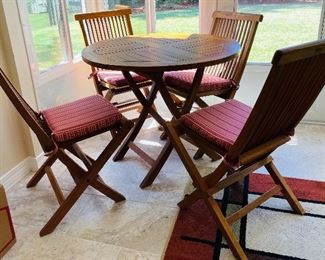 7_____ $750
Chic Teak 5 pieces table set with cushion 36D
Table   • 30high 36 circular across 
chairs 35 high 19wide 22 deep