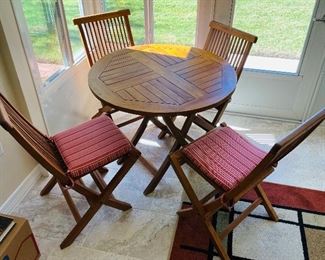 7_____ $750
Chic Teak 5 pieces table set with cushion 36D
Table   • 30high 36 circular across 
chairs 35 high 19wide 22 deep