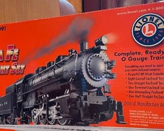 16_____ $110 & $95
Lionel Santa Fe freight train 0 gauge 
Lionel Pullman Passenger Car expansion Pack++ to santa fe package