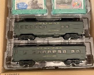 16_____ $110 & $95
Lionel Santa Fe freight train 0 gauge 
Lionel Pullman Passenger Car expansion Pack++ to santa fe package