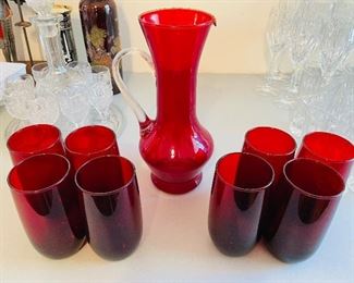 23____$48    red glass 60s pitcher and 8 juice glasses 