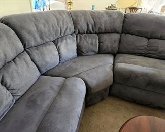 A Section Sofa with two attached/detached recliners in good condition. 