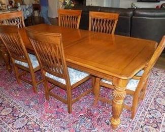Tommy Bahama Pineapple Twist Table  and 8 chairs made by Lexington Furniture.  Seats 4-8 guests.  Measures: 76″W x 45.5″D x 30.5″H. Extends to 120.25" with two 22″ leaves.  The chairs have been re-upholstered with a blue and white paisley fabric. Minor scratches and marks as it's been used to serve family meals.  $2500