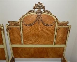 2 French Rococo Louis XV Burlwood Twin Bed Frames - This gorgeous pair of French Rococo Louis XV style twin beds must be bought as a set.  These were made in the USA, Circa 1910 of exotic burled African avodire wood, with paint and gilt details.  Both frames are in very good original vintage condition however, both finials have been broken and glued back on.  Headboard Measures: 51"H x 42" L.
Footboard height: 45"L x 17"H.    $2000  for set.