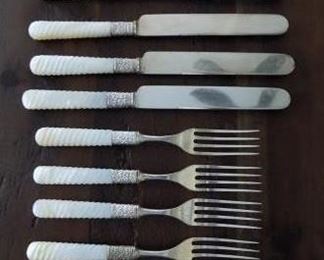 8 Pieces of Vintage Meridian Cutlery Co. Pearl "Twist" Handled Knives and Forks - Set includes 4 Dinner forks and 4 Dinner Knives.  All are marked Meridian Cutlery 1855.  All are in excellent condition with little no rust or corrosion on the bolsters.  They are NOT marked sterling on the silver bolsters but they might be.  Handles have a unique twist or spiral shape to them which seems to more rare than the flat kind.  $100