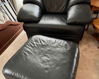 Black leather armchair and matching ottoman
