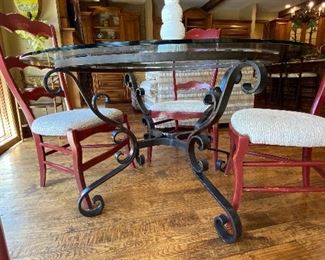 52” round glass top table with black wrought iron base