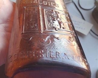 Warner's safe medicine bottle with embossed figural safe