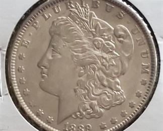 Several Morgan silver dollars in this sale and other US silver coins