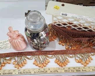old pink lady bath salts container, jar of old buttons, and about 10 feet of fancy beaded trim for lampshades etc crafting / sewing. 