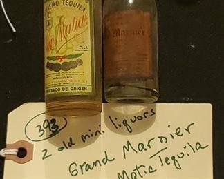 Old old rare liquor sample liquor bottles w original labels.  There are several lots in this auction.  These 2 are Grand Marnier bottle and San Matia Tequila, circa 1930s or so, probably just after prohibition ended. 
