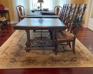 Beautiful Spanish style Dining Table with wrought iron accents. Comes with two leaves.  