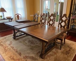 Beautiful Spanish style Dining Table with wrought iron accents. Comes with two leaves.  