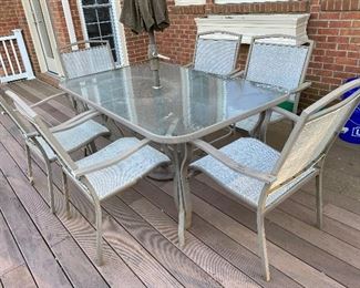 Glasstop Patio Table with 6 chairs Available for Pre Sale as well as Umbrella can be sold with the set 