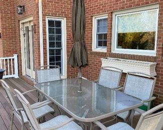 Glasstop Patio Table with 6 chairs Available for Pre Sale as well as Umbrella can be sold with the set 
