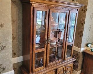 Very ornate and Beautiful dining set purchased at Nebraska Furniture Mart 6 chairs and 2 Captains chairs. The Hutch is by American Drew and is 53" W x 16" D x 79" H